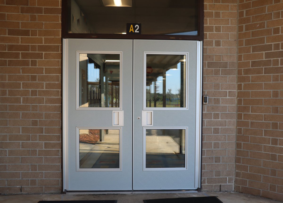 Flo1Schools's tweet photo. Updates are continuing around Dewey L. Carter with more brand-new exterior doors being installed. Students are also excited about the new basketball goals on the back playground! #StudentsFirst #F1SBuilds https://t.co/Lt00ENAvfx
