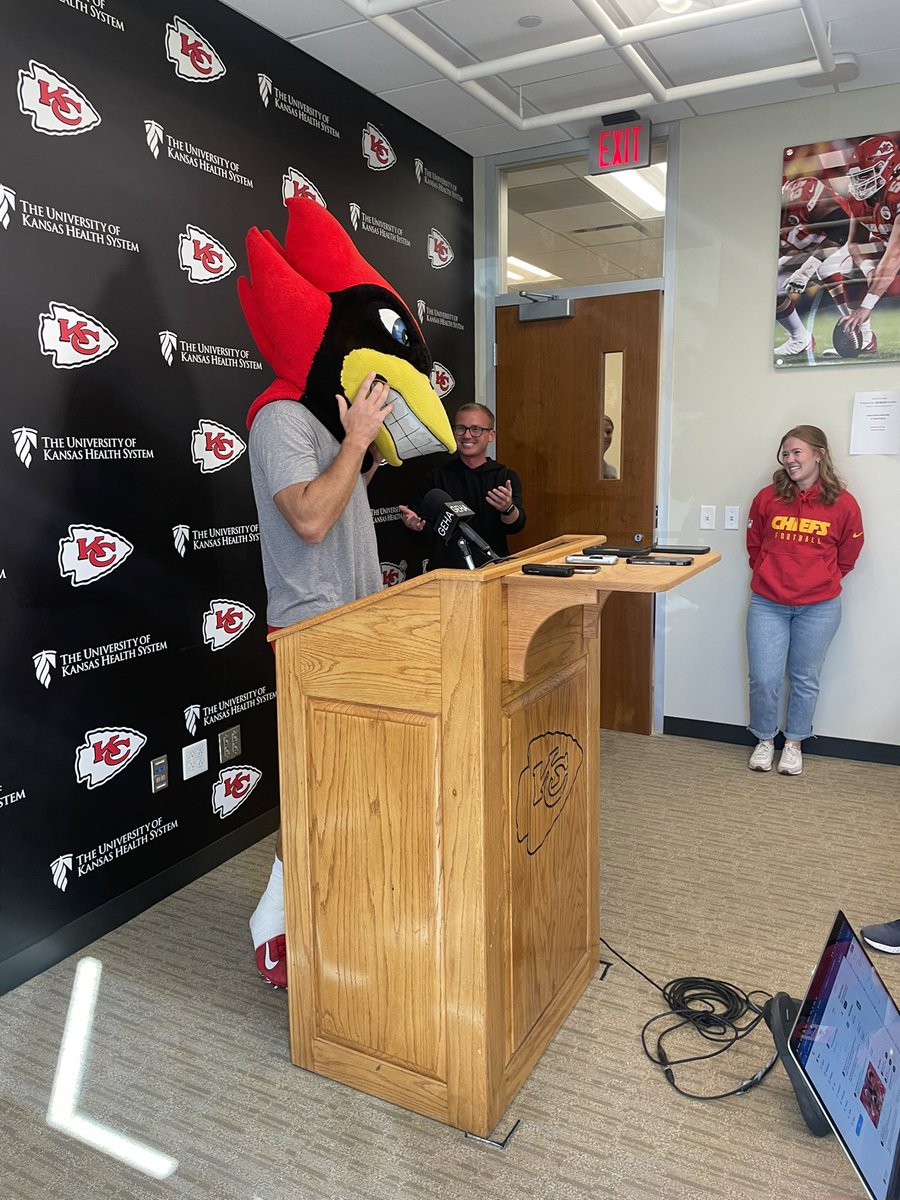 Travis Kelce arrives in an Iowa State mascot head after Cincinnati lost to the Cyclones.