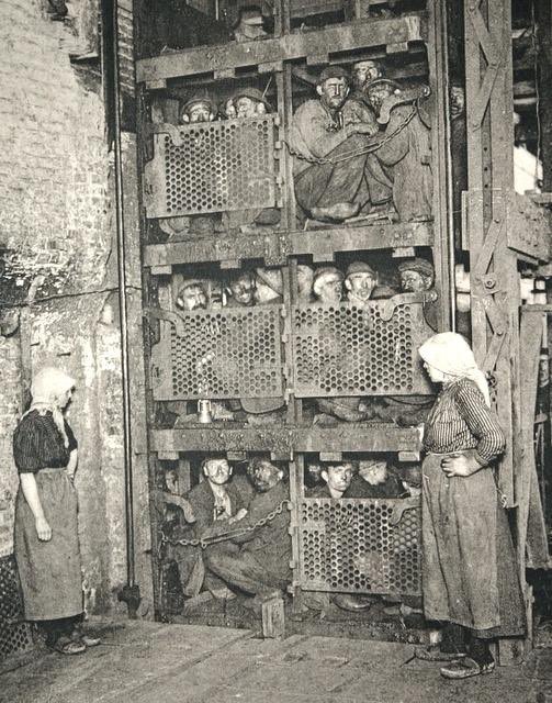 Coal miners returning from the depths after a days work, Belgium, circa 1900.