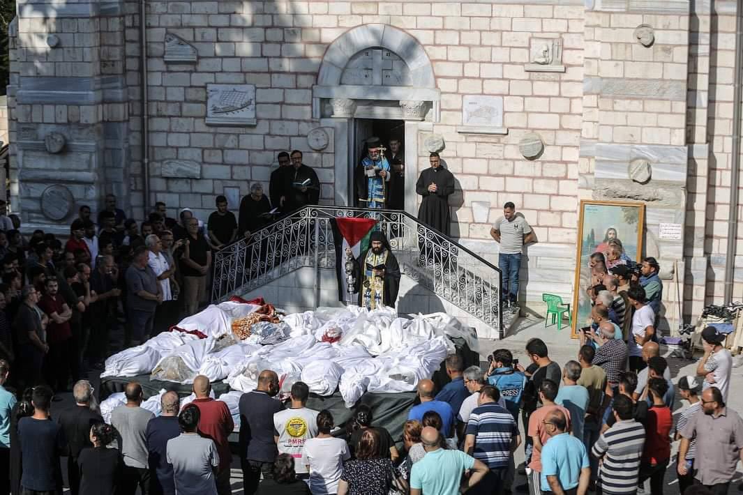 jacksonhinkle's tweet photo. 🇮🇱 Memorial procession for the 18 people (INCLUDING 8 CHILDREN) that ISRAEL BOMBED on the grounds of the OLDEST CHRISTIAN CHURCH in Gaza yesterday. https://t.co/9jza3SLyi7