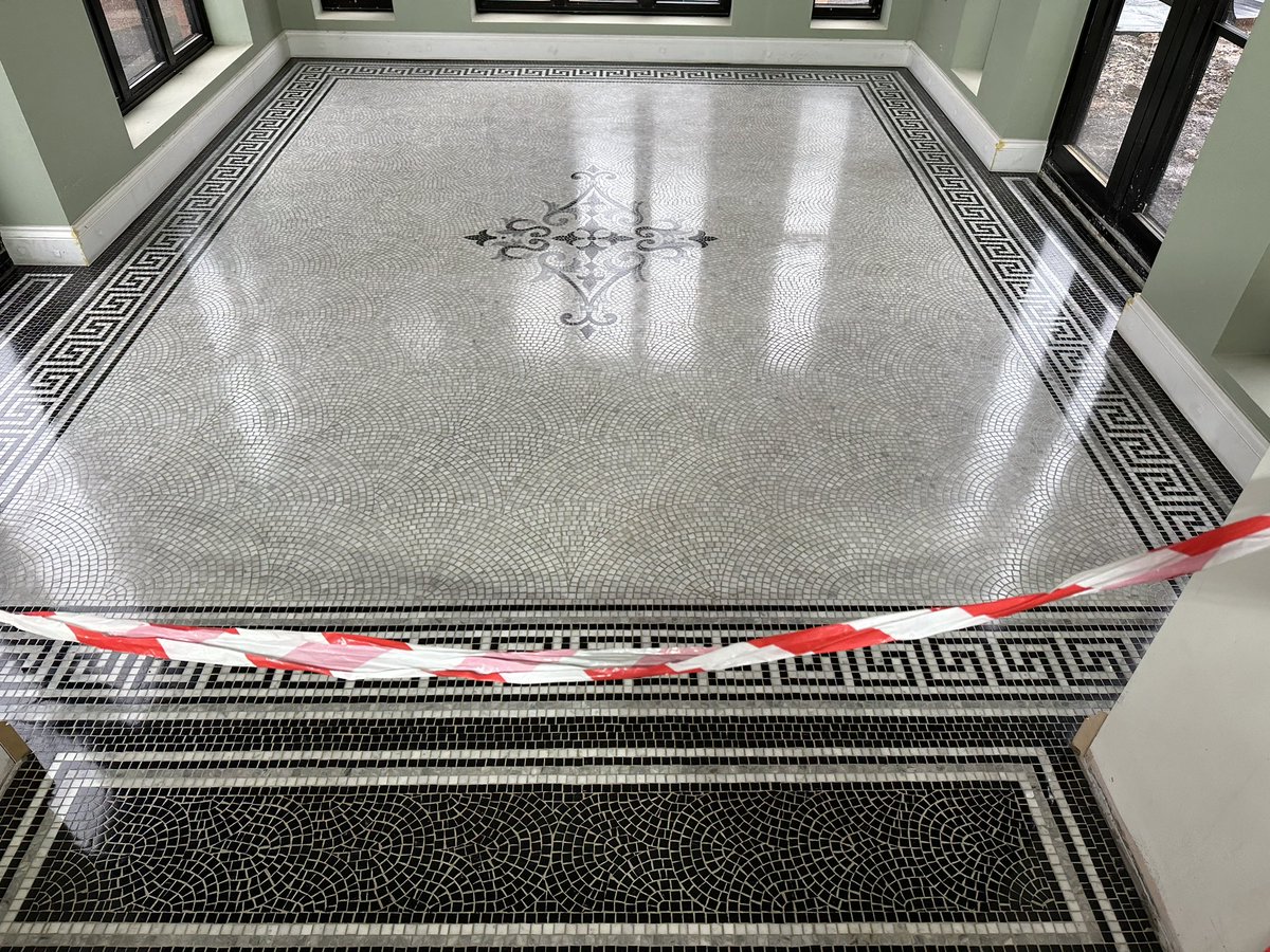 New bespoke marble mosaic installed in Market Harborough. Hand-cropped bianco carrara, belguim black with a mix of various grey stones to greek key perimeter, thresholds and central motif. No maintenance required for another 150+years, usual lifespan of traditional marble mosaic