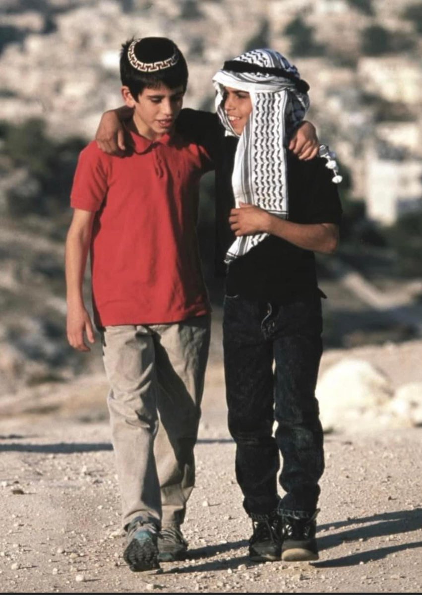 doolsalat's tweet photo. Look at this picture. Look it very carefully and see what it's telling us as human beings. Two young friends. An Israeli and Palestinian boys. Today, the world is full of war, death and destruction. Innocent people are dying and we have forgotten about humanity, love and friends https://t.co/hUtSerG8lo