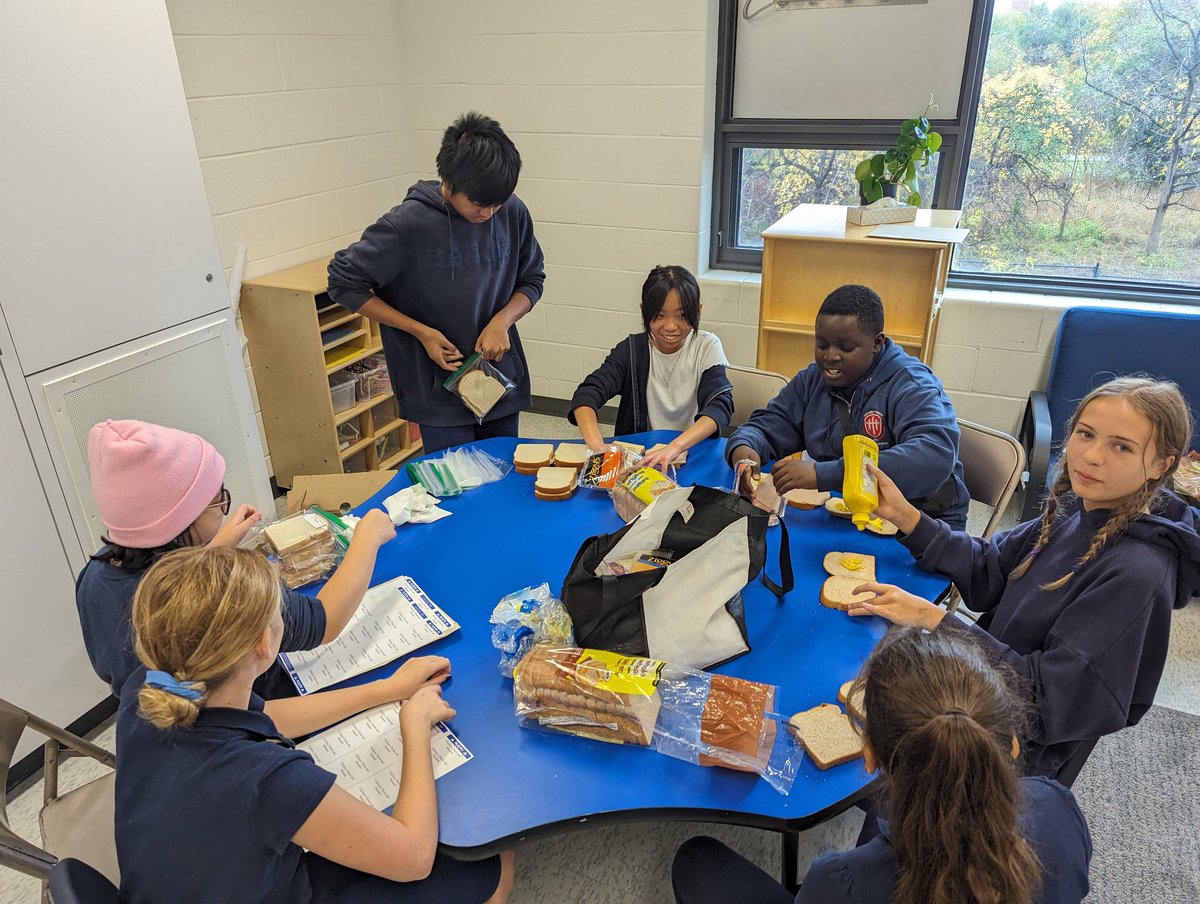 MrBsLeaders's tweet photo. Our GivECO Leadership Team took on a new meaningful task this week. @TCDSB_THT connected with @FJRCSS and their ME students to help make sandwiches for their street patrol.

We were shown how to ensure a clean workspace, assemble, and package.  We'll continue this mission weekly! https://t.co/u2yuSqLiRJ