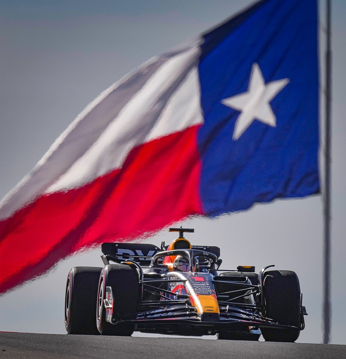 Red Bull driver Max Verstappen of the Netherlands flies over Turn 10 under a vast Texas flag during a Formula One U.S. Grand Prix practice session in Austin, Texas. #sonyalpha #sony600mm #alpha1 #texas #formula1 #f1 #racing #cars #cota  #speed #austin #circuitoftheamericas #r ...