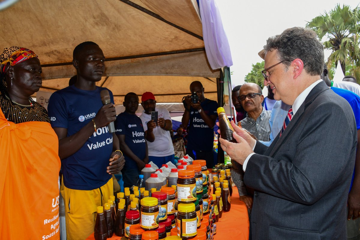 rassactivity's tweet photo. 🌍US Ambassador Michael J. Adler engaged with USAID-supported honey &amp; shea producers in Rumbek. RASS Activity is unlocking value chain potential &amp; creating market-driven economic ecosystems for inclusive development in South Sudan. #ValueChains #EconomicDevelopment #Agriculture https://t.co/QiA7Sc2S7Q
