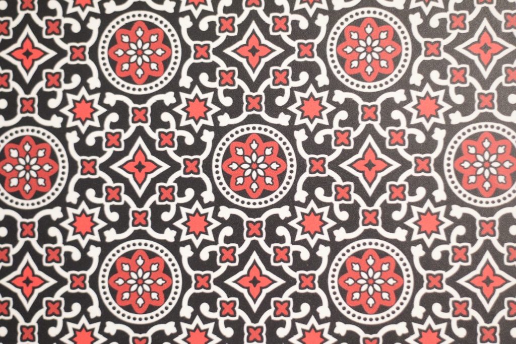 This artwork features an Ajrak textile. Ajrak is a form of block printing common to Sindh, Pakistan and is one of the world’s oldest living textiles.