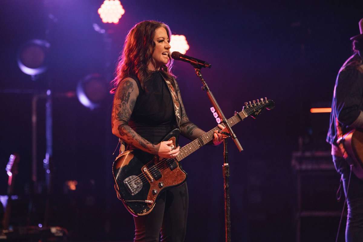 AshleyMcBryde's tweet photo. #TheDevilIKnowTour has BEGUN!! Thank you @Fender  Custom Shop for my gorgeous Jazzmaster!! I call her Betty, of course. 
And who could miss that #BuckinBuckarette strap?!
It’s badass playing this beauty on any night since we designed her …. but it’s all full circle having her in my hands on THIS tour.
@FenderCustom @DaddarioandCo