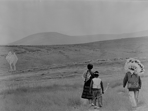 UCI honors #IndigenousPeoplesDay. Descendants of Gabrielino-Tongva tribe in 1963 hike past the marker of the Irvine Co. donation to UC Regents. Local indigenous people remain valued partners in advising on the responsible & sustainable transformation of campus. 📸 @ucilibraries