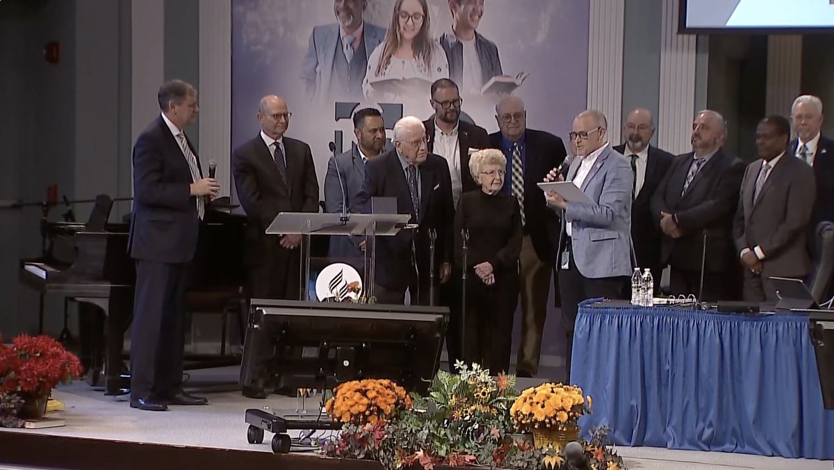 With his wife, Pat, at his side, Dr. Ralph S. Watts is presented with a trophy for his service to the Church and a surprise from ADRA, who is donating US$1 Million toward The Ralph Watts New Entry program to develop young, Seventh-day Adventist Professionals for ADRA worldwide.
