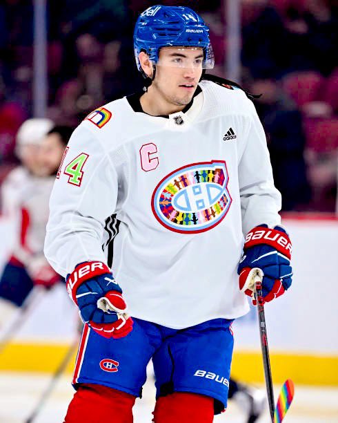 Don’t mind me, just posting this photo of captain Nick Suzuki in a Habs pride jersey from last season for “no particular reason.”
