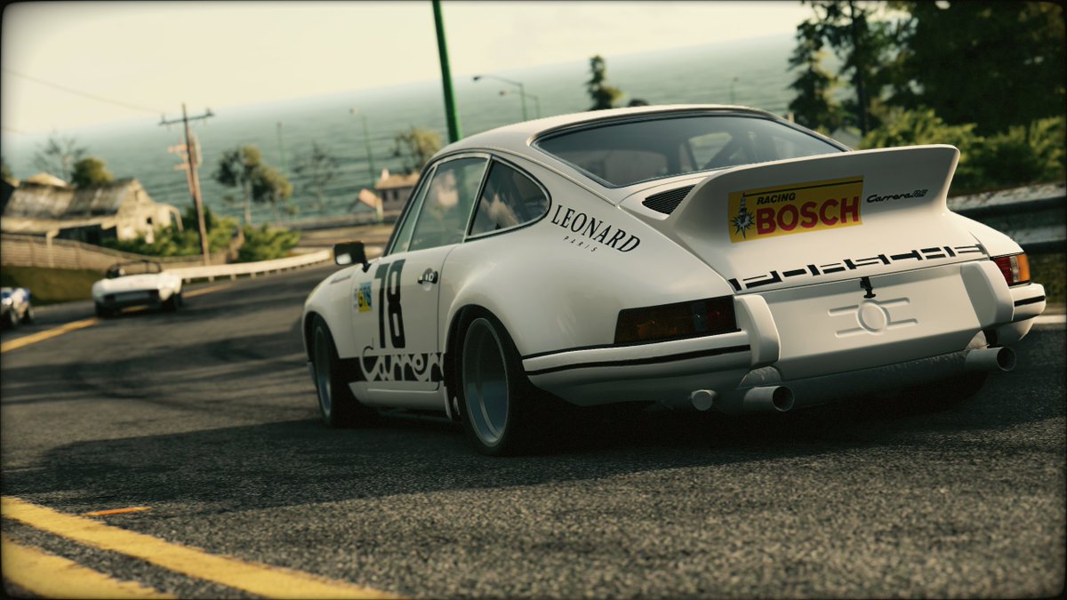 Shiroi_Jenkins's tweet image. #Cartober, but virtual photography 
Day 7: An iconic sports car, the 1973 Porsche 911  Carrera RSR carves up the California coast. #ProjectCars2 #VGPUnite