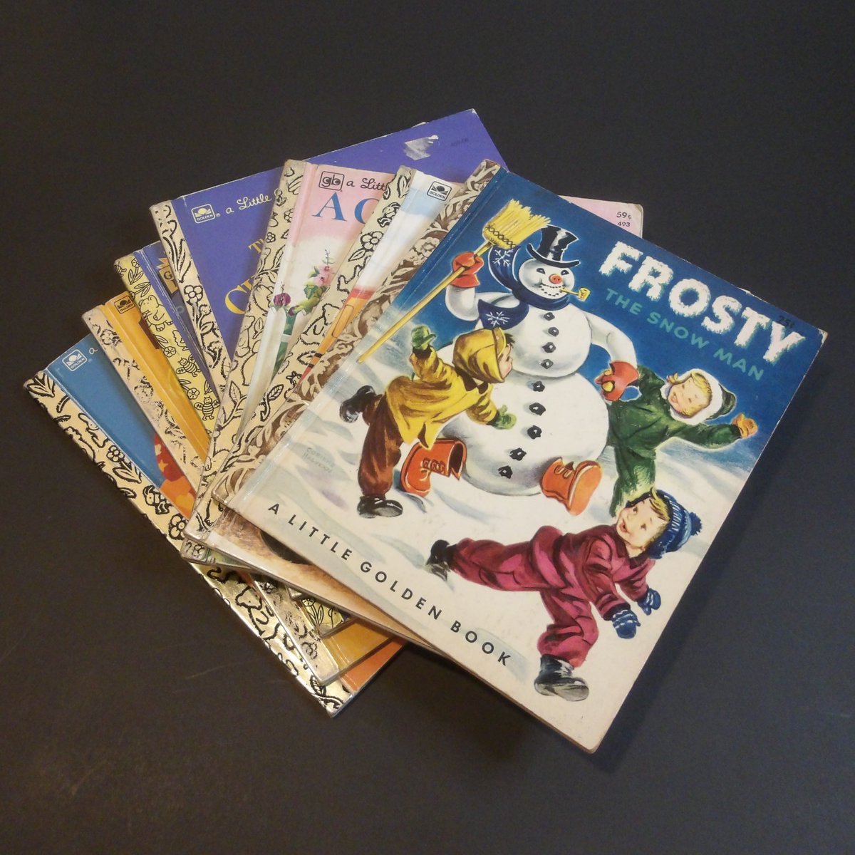 cottagebird's tweet photo. Vintage Golden Books Lot Hardback Collectible Children’s Books 1951-1997 #kidbooks #giftbooks #christmasbooks #junkjournal #collagefodder – less than $40 for all 7, with free shipping! Click now to make them yours https://t.co/r1sxk3fO37 from @cottagebird via #etsy https://t.co/WcAcR7GFNI