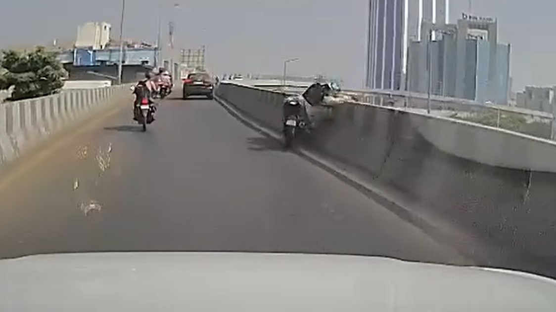 A biker survives strange accident on Surat ring road bridge’s approach; Video goes viral