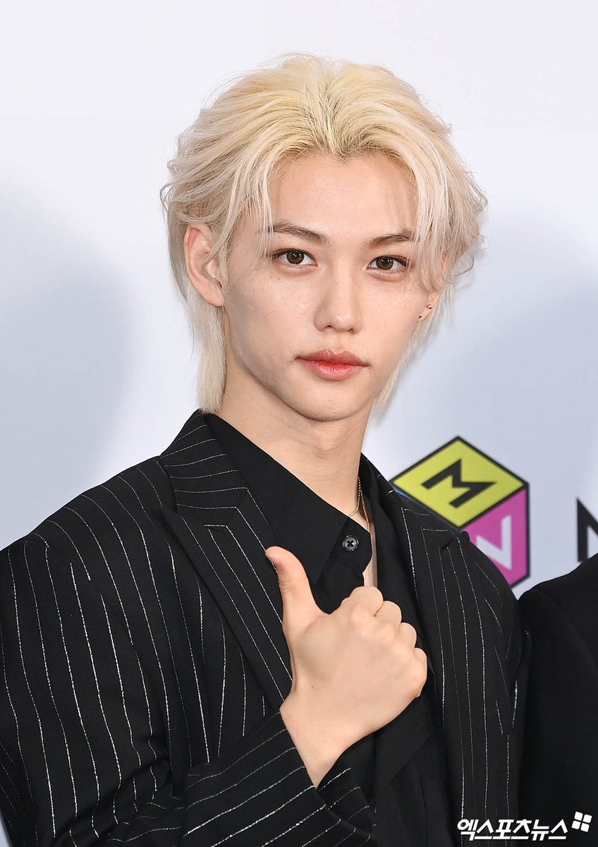 viraltakes's tweet image. Stray Kids' Felix at the 2023 The Fact Music Awards red carpet.