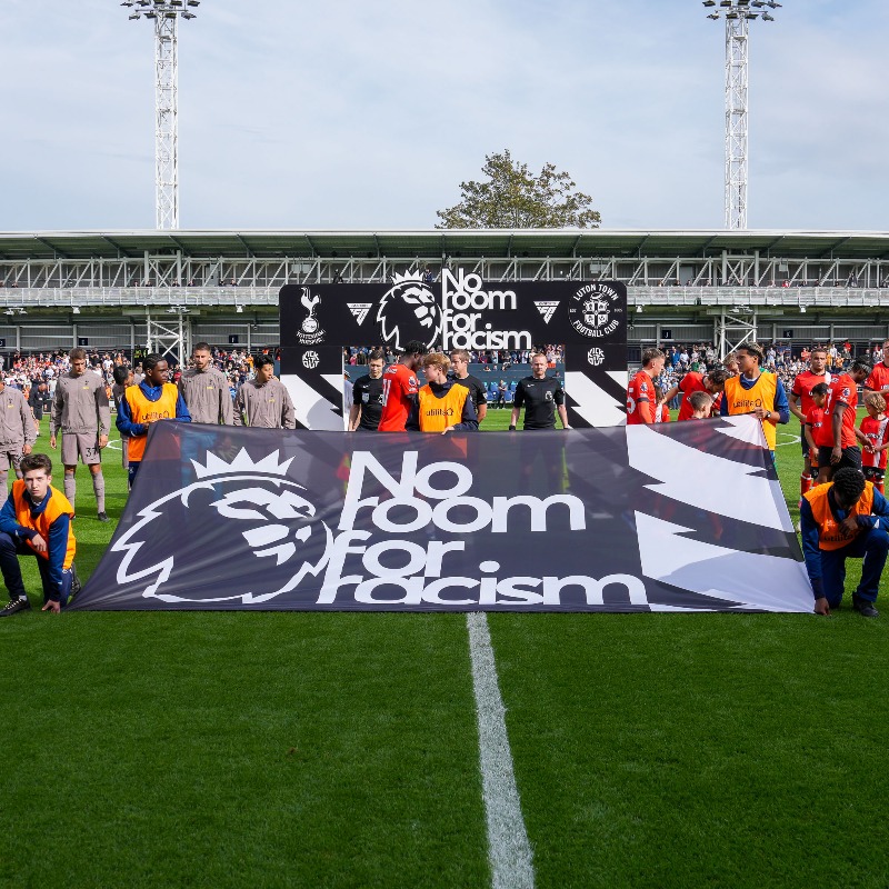 LutonTown's tweet photo. We stand with our striker, Elijah Adebayo, who once again has been the target of a vile, cowardly act of online abuse. 🧡

We will continue to do our bit to eradicate racism. For everyone.

#NoRoomForRacism