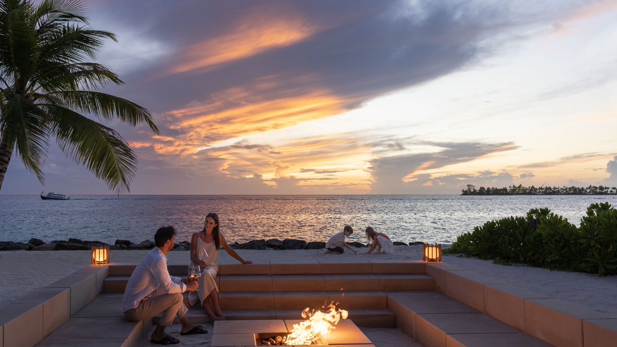 Craft cherished memories at The Ritz-Carlton Estate, as your family comes together by the fire pit, with dolphins creating enchanting moments at sunset. #CircleofIslandLife #RCMemories #EmbraceIslandLife