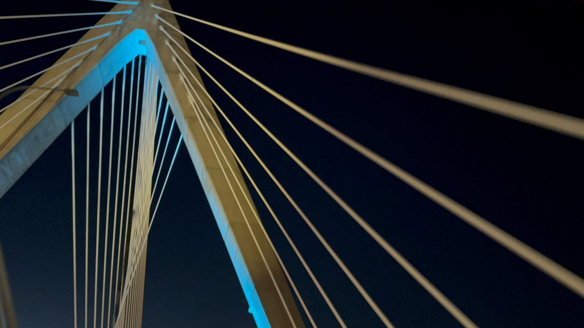 OCDNews's tweet photo. Boston's Leonard P. Zakim Bunker Hill Memorial Bridge and Prudential Center lit up in teal to kick off OCD Awareness Week. #TealforOCD #OCDweek @IOCDF https://t.co/mpixN2z7uh
