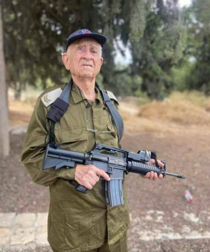 Ezra Yachin, at 95, is the IDF's oldest reservist. He's been drafted into the reserves to boost morale by talking with soldiers. Despite enduring a tough childhood in Jerusalem marked by riots and unsettling scenes, he and his friends played a role in founding our great nation.