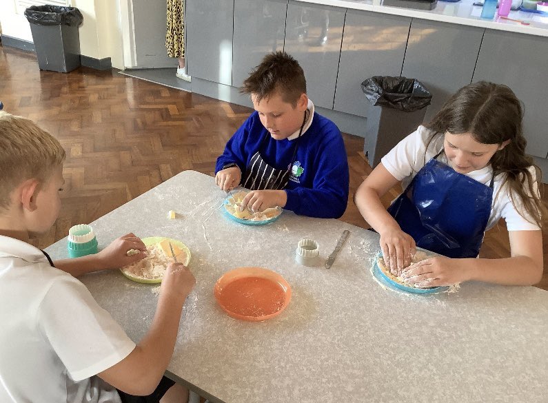 Lucybee198's tweet photo. The Great British Bake Off came to Inkersall this evening as the children made and decorated their own biscuits and also made edible cookie dough too. What a brilliant few weeks we’ve had with year 6 at cooking club. @ipa_spencer @satrust_ https://t.co/CEgOpH5lsu
