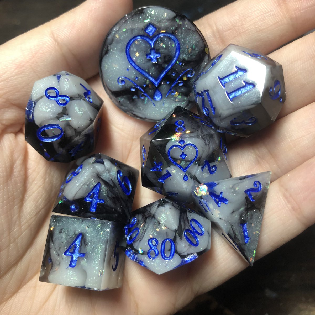 HealersHug's tweet photo. Dice commissions are open! 
•8 piece set (includes standard 7 piece dice set, coin and crystal keychain or pendant) - $90
•D20 pair - $40
Prices may vary depending on complexity of design. 
Message me for details! link below! 

#dice #ttrpg #dnd #dnd5e https://t.co/4tf9fP8CMI