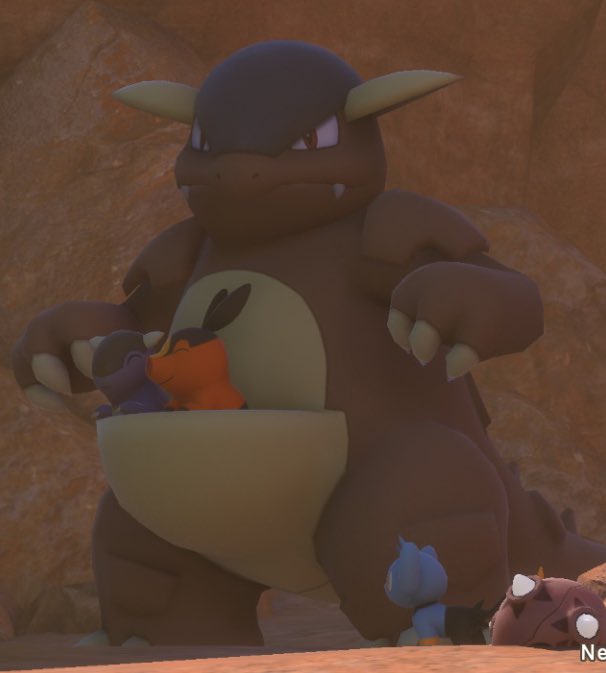 PokemonGems's tweet photo. tepig is sitting in the pouch with the baby 🥺 https://t.co/z33PXDTTJ3