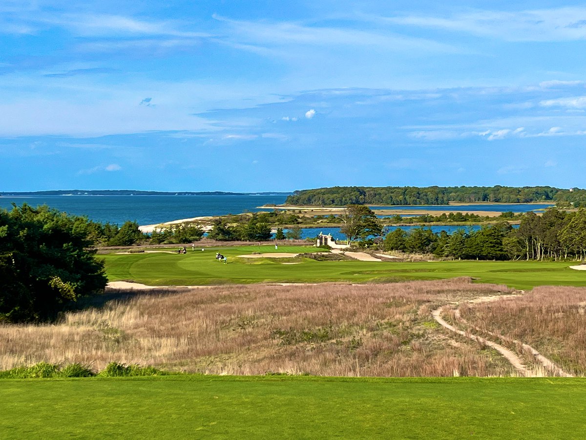GCAJoeA's tweet photo. National Golf Links of America
1908 C.B. Macdonald

Macdonald set out on a mission to build a golf course that would resemble the greats of the British Isles. CB found a piece of property on the Peconic Bay of Long Island and with the help of a local engineer, Seth Raynor, the two crafted an architectural masterpiece.

NGLA, weaves you out towards its next door neighbor, Shinnecock Hills, and then back to the clubhouse which sits atop a hill overlooking the Peconic Bay. The holes each have their own personal characteristics - some with massive Sahara bunkers, some with tiny pot bunkers, greens that are plateaued, thumb printed and punchbowled. The fairways are firm and fast, guarded by native fescue areas and the greens roll like table tops.

“National” as it is affectionately called, is as fun to play as any. Each hole tells a new story and the walk out and back is one of the most enjoyable you’ll ever take on a golf course. Today was a dream for me - it was utter bliss. The weather was 65 and sun and just the right amount of wind. If there is a heaven on earth, I believe I was there today.