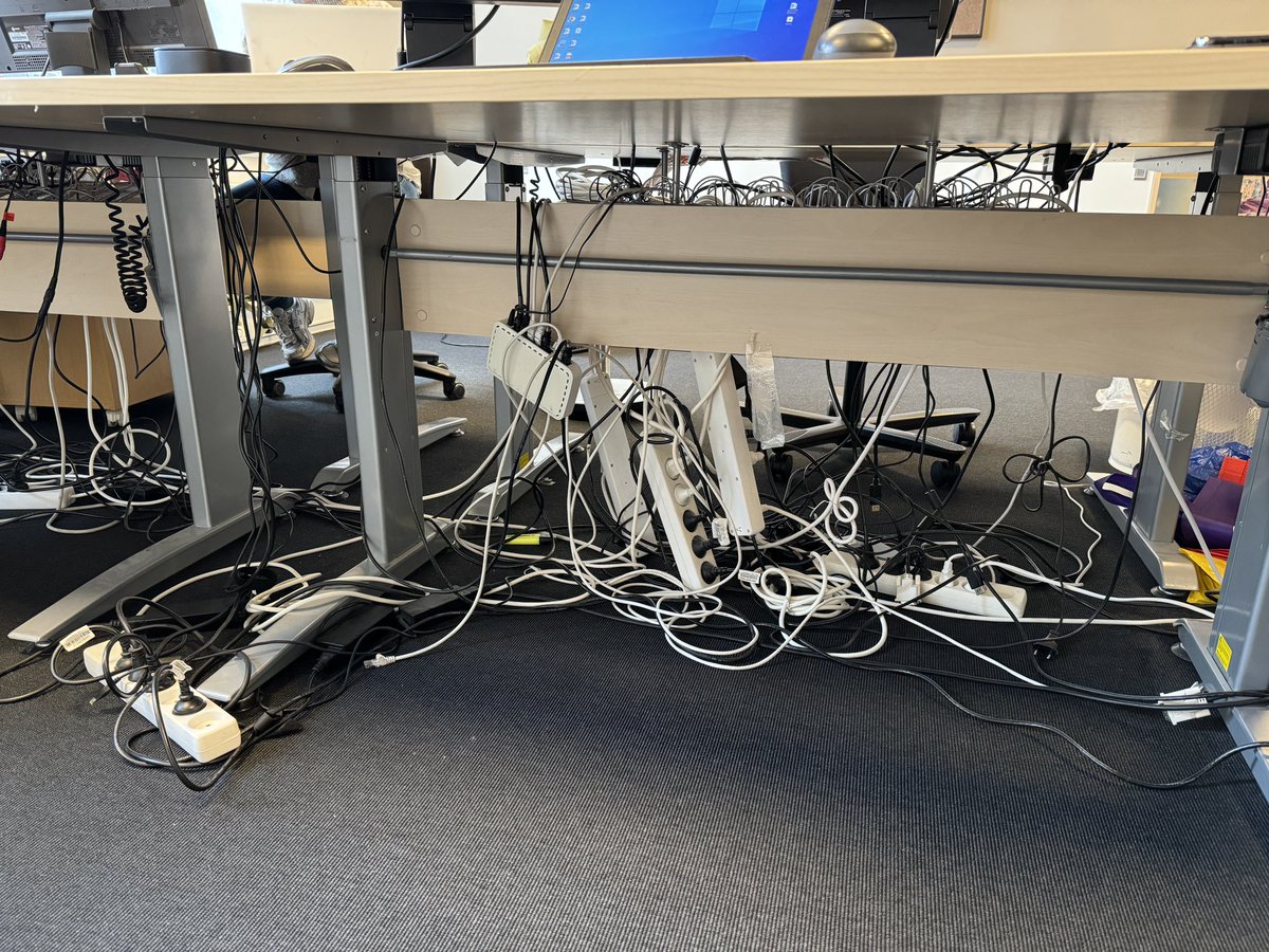 Going digital they said... It'll reduce clutter they said... Now my under-the-table looks like it's hosting a wires-only party! 🎉🔌 #DigitalDilemmas