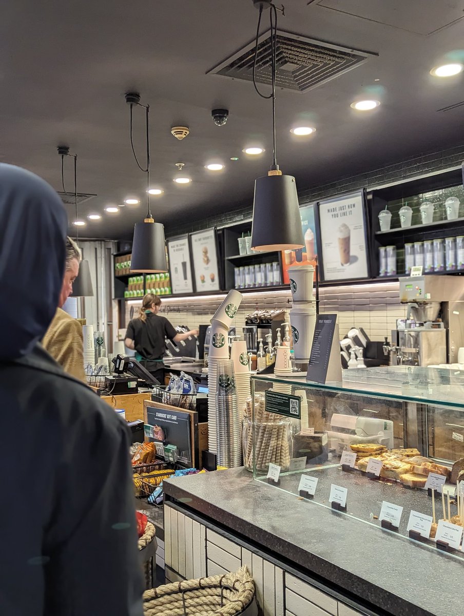 Wingria's tweet photo. @StarbucksUK Get this man some help. Fantastic employee holding down the fort at Edinburgh airport. It's 3:40am and he's serving 50+ and running your shop all on his own. Doesn't look good from an employer who says they care about their employees #Starbucks #Employment #staffing https://t.co/aT48WsWv5G