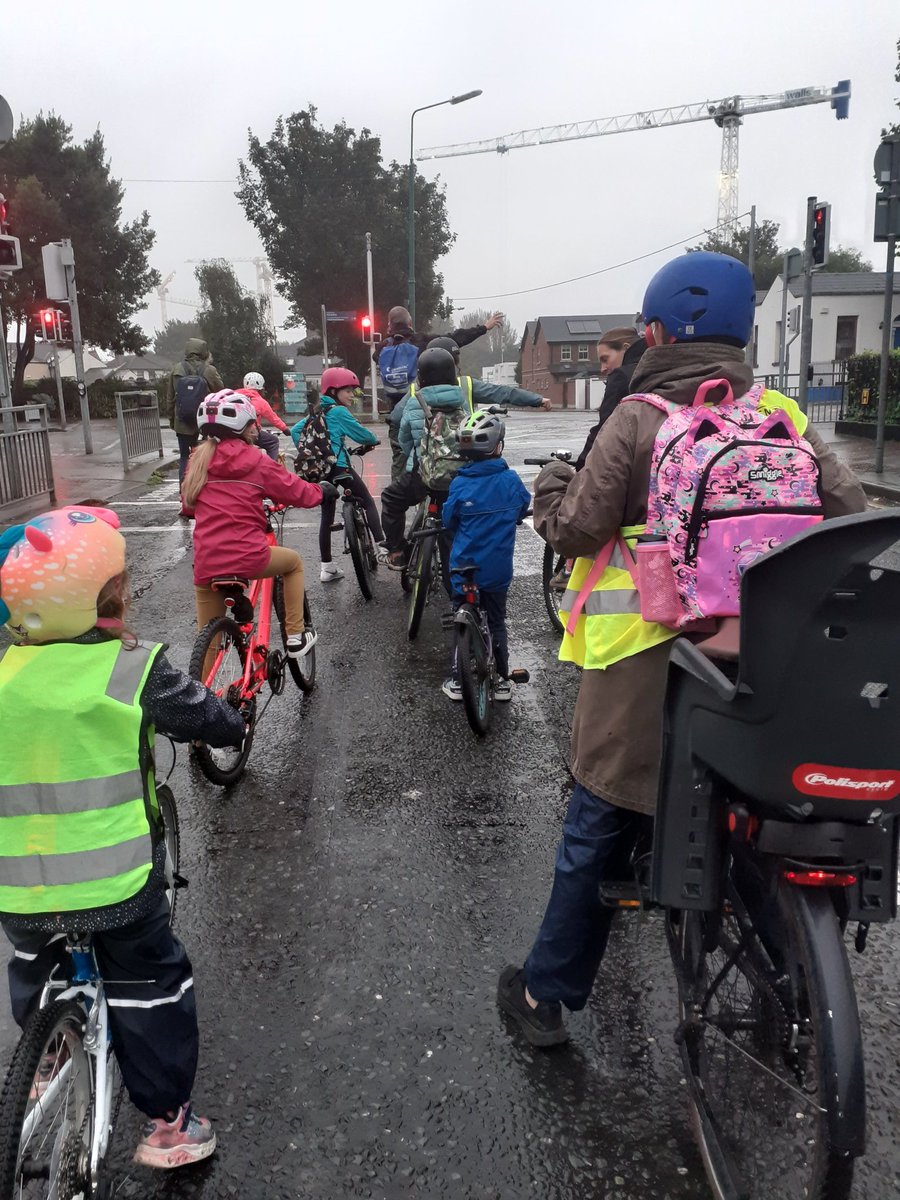 SandymountCB's tweet photo. The drizzly cold morning was a bit of a shock to the system after the recent hot, dry spell but that didn't put off the #cyclebus participants from @ShellybanksET and @SSandymount. Waterproofs on and off we went! #BikeBus #bicibus https://t.co/g5UKFJ7GOV