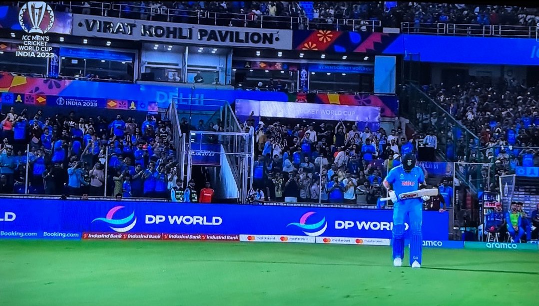 CSKian716's tweet photo. What a moment. Kohli walking out from the Virat Kohli pavilion in Blue. Feels like we took this journey with him. https://t.co/acpwtAtsw8