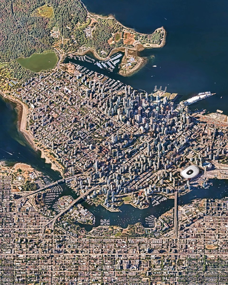 DOverview's tweet photo. The commercial center of Vancouver, British Columbia—known as the Downtown Peninsula—extends like a thumb into the Strait of Georgia, which leads to the Pacific Ocean. This area contains most of the city’s remaining historic buildings and nearly all of its tallest skyscrapers. https://t.co/cwIF4chYDf