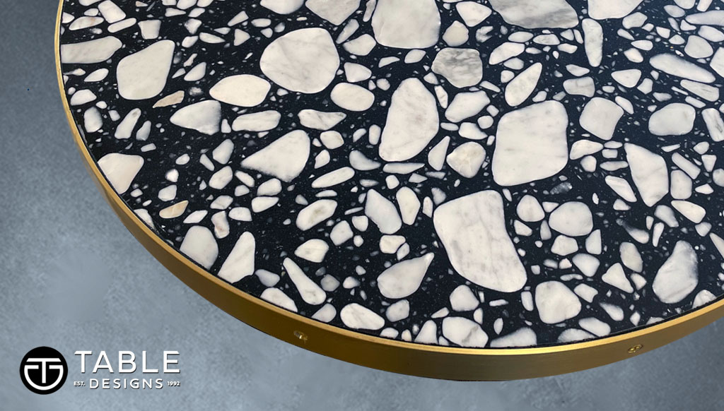 Here's an impressive Marble Tabletop elevated with a gleaming brushed brass metal edge design, that's sure to command attention in its new home.
#MarbleTabletop  #CustomMarbleTabletop #StoneTables #CustomRestaurantTables #RestaurantTables #HospitalityFurniture #TableDesigns