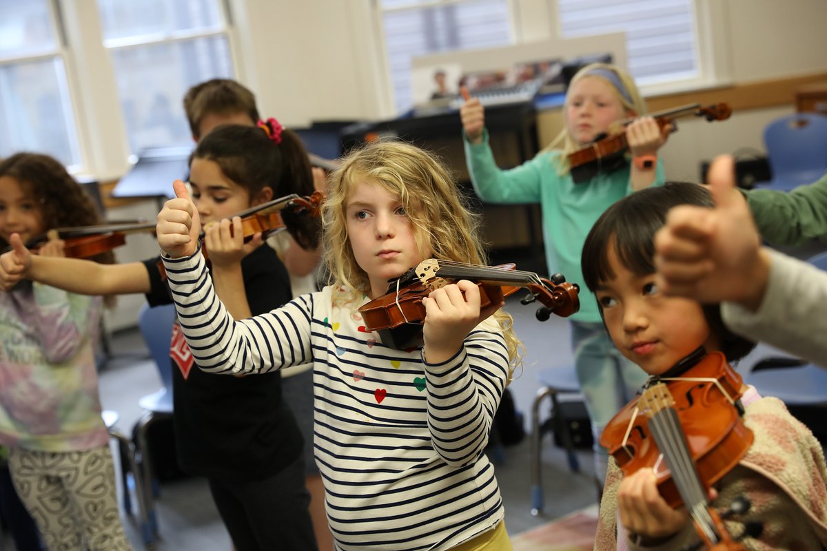 Thumbs up to learning about the violin! In their first lesson with Ms. Carye '91 and Teacher Cotner, second graders started with the basics, such as how to properly hold and care for the instrument, and the sounds of its strings. #education #music #arts #independentschool