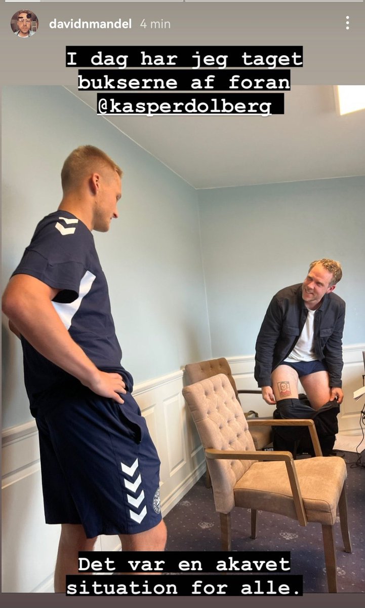 CheapPanini's tweet photo. Our Danish isn’t great but we *think* this is a journalist dropping his trousers to show Kasper Dolberg a tattoo of our drawing of him that he has on his thigh.

The world is amazing and, in many ways, absolutely terrifying. https://t.co/ucDmYkAO8R