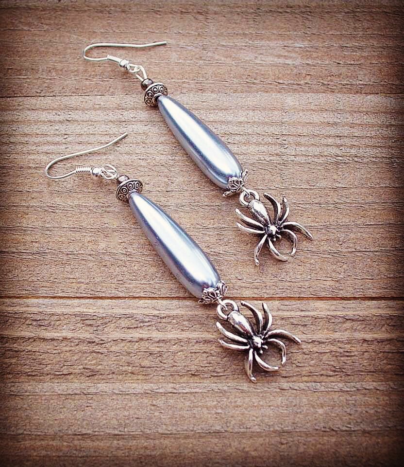 Silver Spider Earrings for the Spooky Season by Rayvenwoodmanor Jewelry. Long Swarovski grey teardrop pearls accent the silver spiders. Sterling Silver Ear Wires. In my Etsy shop now! Link in Bio. #spider #spiderearrings #spiderjewelry #rayvenwoodmanor #rayvenwoodmanorjewelry