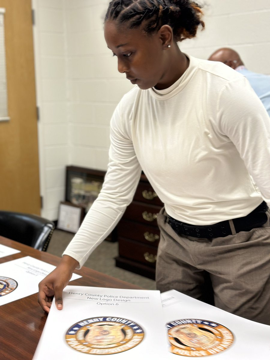 AAS_HCS's tweet photo. @HenryCoPolice future logo may be the brainchild of one of our own!  Lailah, an associate in @bcilloz graphic design class, presented her work to members of the force today! #winningforkids #associateexperience #empoweringtomorrow @DLinnBwell @Toni_Collie @shaykele78 https://t.co/ti8v2doIgr