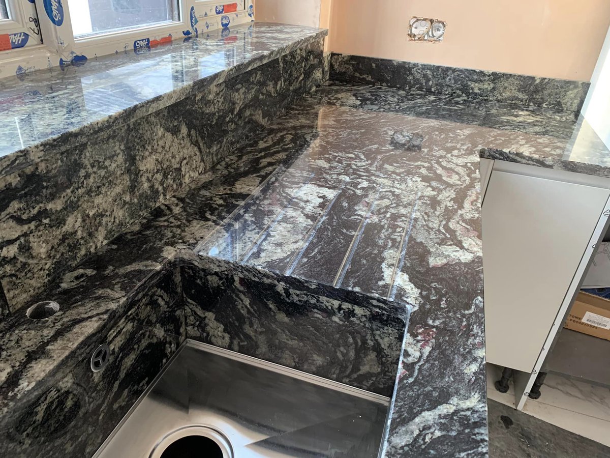 30mm Sensa Indian Black granite from @CosentinoUK is a beautiful and dramatic worktop, ideal for making a statement! Take a look at the range of colours and patterns available on our website - marble-granite-quartz.com/materials/gran… #graniteworktops #sensagranite #dreamkitchen #kitchendesign
