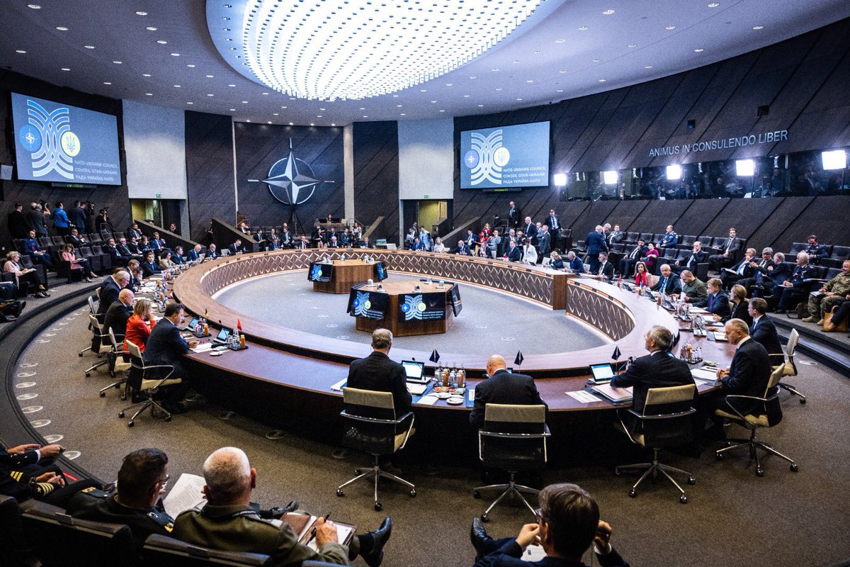 DefenceU's tweet photo. For a first time 🇺🇦 sits at the table with @NATO member countries as an equal partner, not a guest. The historic NATO-Ukraine Council at the ministerial level. 

We have a clear signal - Ukraine will be a part of NATO and the members of the alliance will help us as long as necessary. 
Thank for your support!