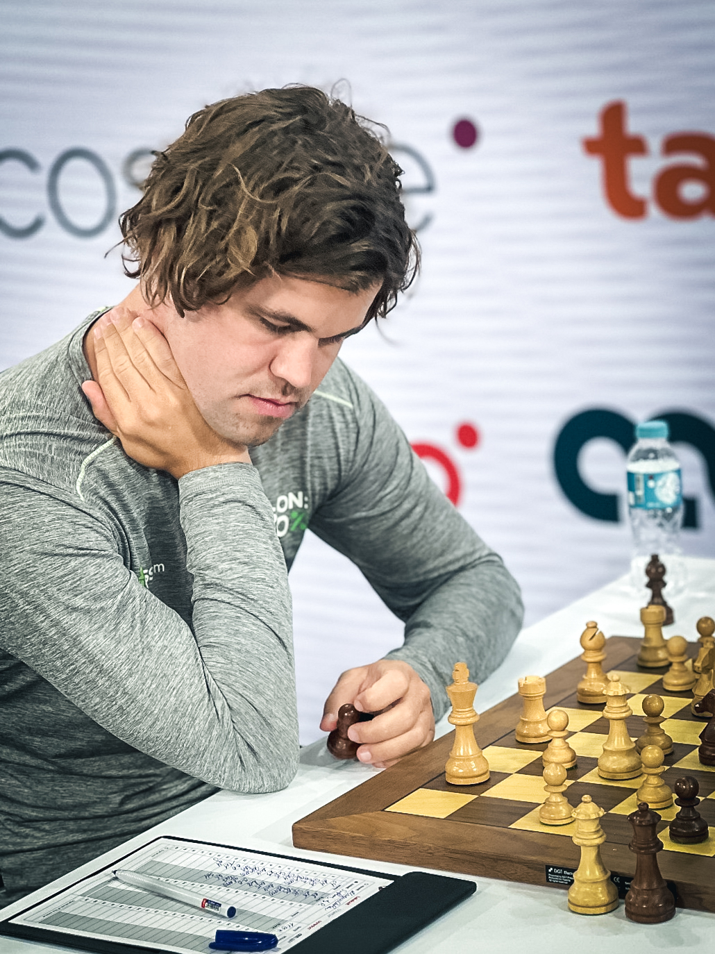 Carlsen jumps in standings with win, Qatar's Aziz plays out draw