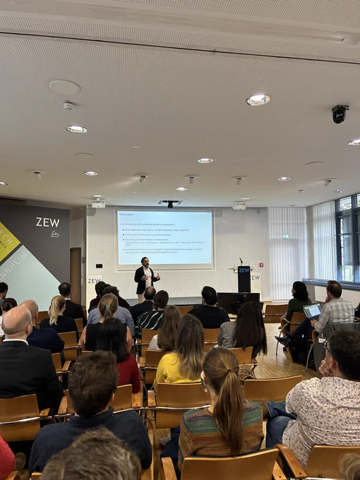Ufuk Akcigit from the IWH Halle during his keynote on privatisations and industrial dynamics in East Germany at ZEW Mannheim.