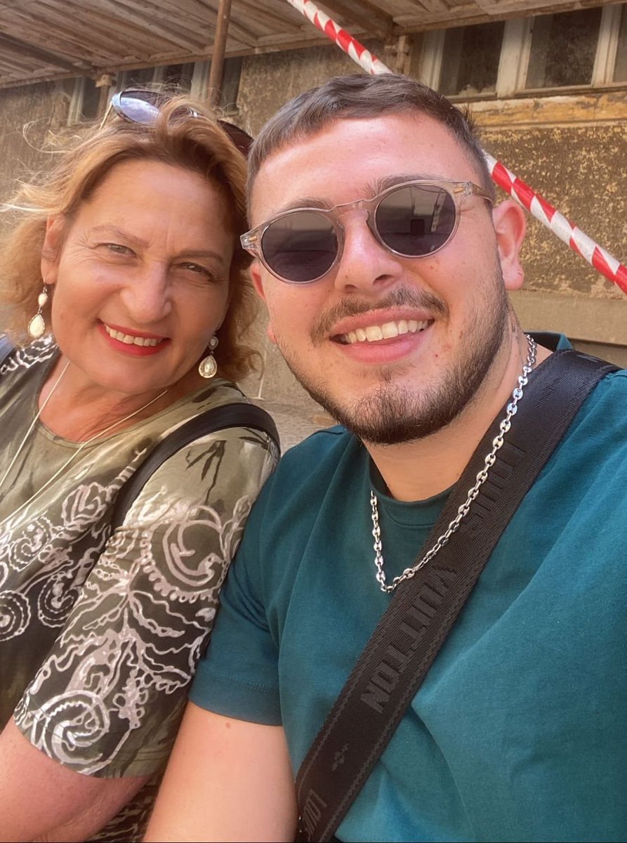 EylonALevy's tweet photo. This was Almog and his mother in happier days.

This was Almog cowering from his Hamas tormentors.

Nobody knows what Almog's condition is now. He has almost certainly been tortured, possibly to death. 

Don't look away. #October7Massacre https://t.co/eJ3qyUe2BT