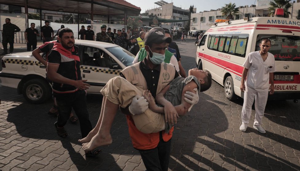 ishaantharoor's tweet photo. Photos from today in Gaza City by Loay Ayyoub, on assignment for the @washingtonpost, outside al-Shifa hospital. Last image are of the bodies of an entire family killed in an airstrike: https://t.co/G2HhLHqqr8
