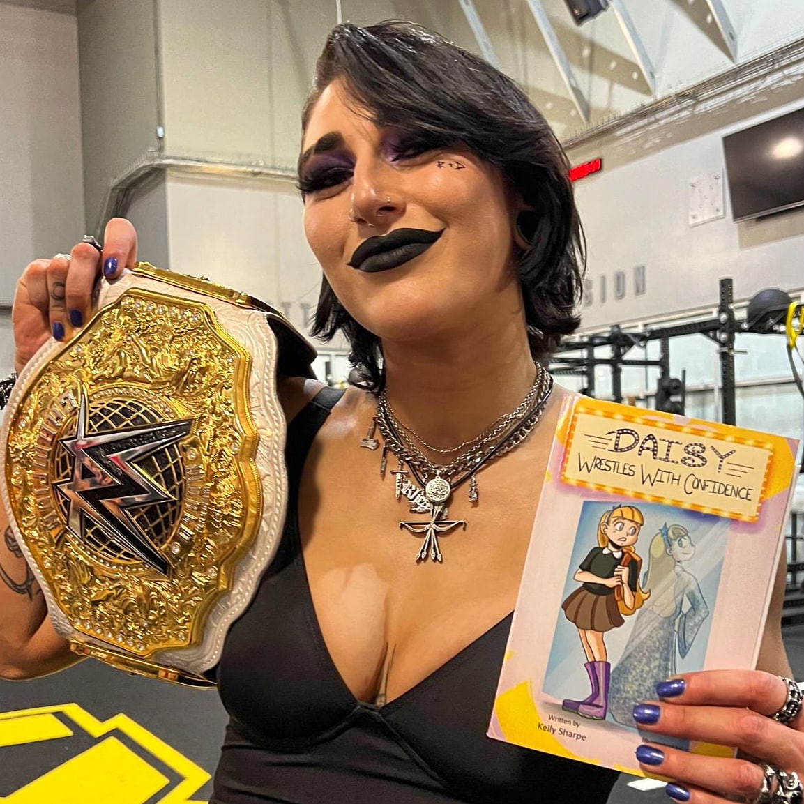 TheBlossomTwins's tweet photo. #TBT to @rhearipley_wwe holding a copy of mine &amp; @ConvivialThe children's book!💜

This book is full of our favourite things; strong women, kindness, confidence in yourself &amp; what you like &amp; of course, wrestling!

#DaisyWrestlesWithConfidence is OUT NOW!

https://t.co/FCj80fFCMa https://t.co/E2XmDHLml2