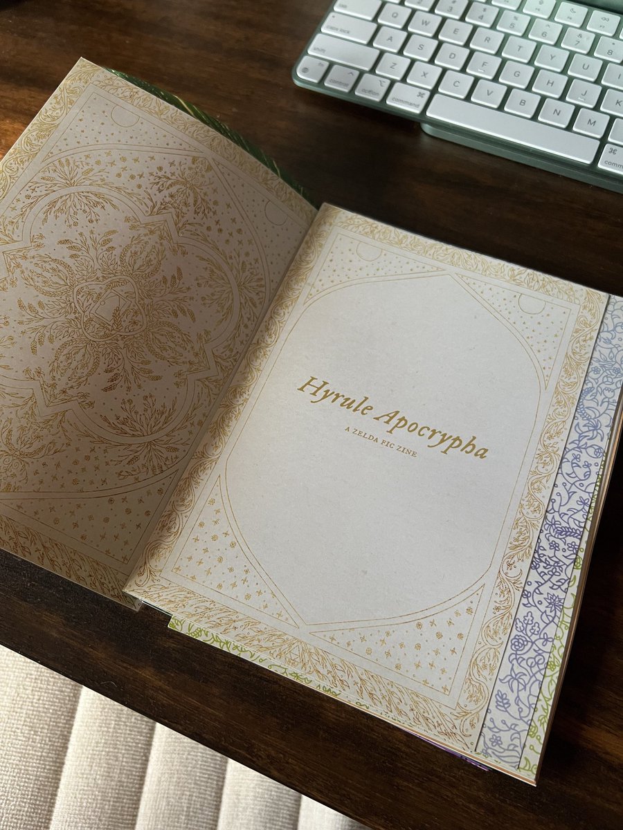 ZeldaFicZine's tweet photo. 📚 Production Update! 📚

Look at our first sample of the zine! Isn't it so pretty?! 😭✨ Thanks so much to our Graphics Mod for taking the pics!

List of credits:
💚 Layout: @rachelsandene 
💙 Cover: @mousesize 
🧡 Interior title: @ksenijahoshi 
💜 Spread: @wyrmsfornerves https://t.co/cGm05rweON