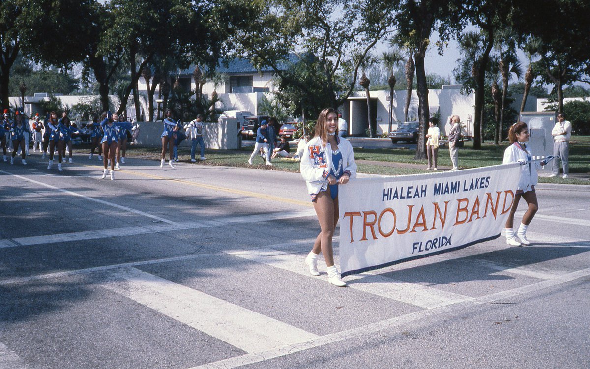 MiamiLakesNews's tweet photo. Salute to service! This #ThrowbackThursday to the '80s shows the Trojan Band from Hialeah-Miami Lakes taking part in the Town's Veterans Parade. Marchers on Miami Lakeway N, making their way toward NW 67th Ave, show their pride at the County's longest running parade. #MLHistory https://t.co/736r9OJNi9