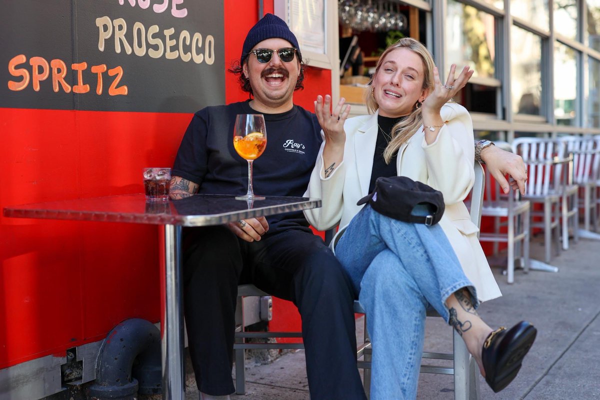 “Picture it, okay? Mardi Gras. New Orleans. Bourbon Street.  I’m on college break with my three best childhood friends. Zak is there with his parents. He’s got his mom and dad with him. So it’s two different vibes, but somehow we all end up on the balcony of the same bar.