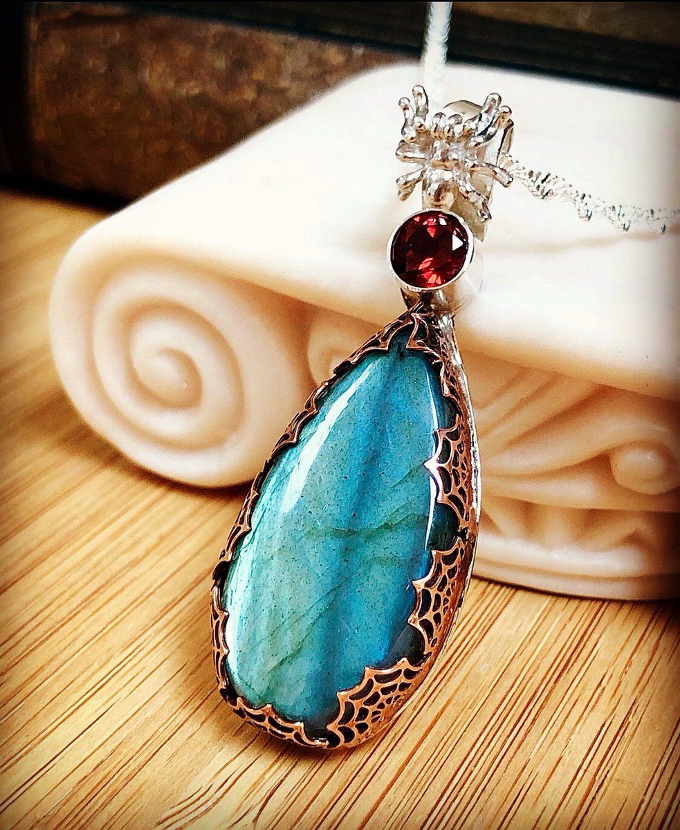 Labradorite Sterling Silver Pendant with Set with copper Spider Web bezel. A large statement piece perfect for the Fall Season! Handmade by Rayvenwoodmanor Jeweley and OOAK! #sterlingsilver #sterlingsilverjewelry #halloweenjewelry #spiderjewelry #spiderweb #silverspider