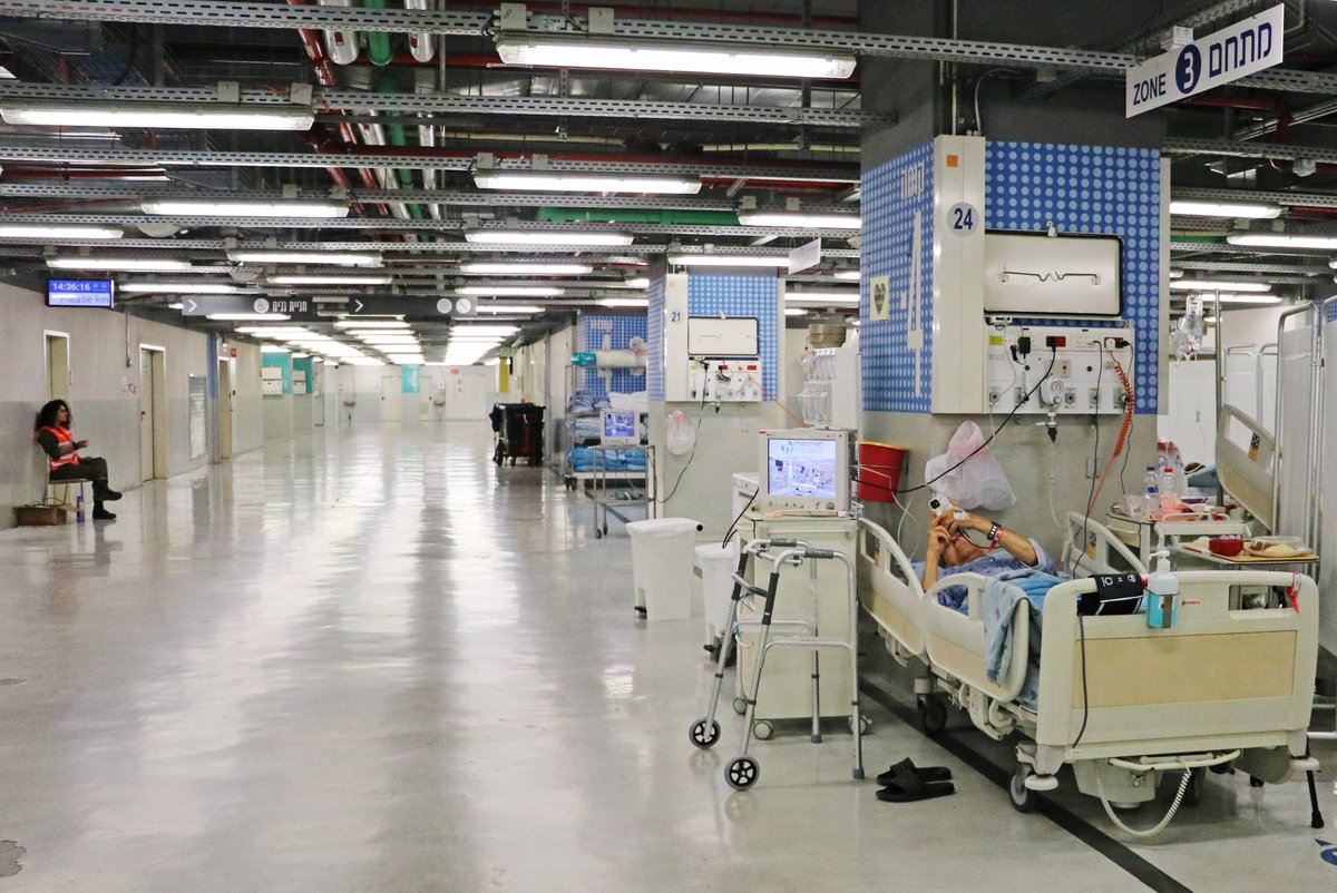 NBCNews's tweet photo. A parking lot at the Tel Aviv Sourasky Medical Center is being transformed into an "underground hospital," with doctors, nurses and other hospital workers working to move as many as 700 patients below ground level. 

📷 Chantal Da Silva / NBC News

https://t.co/PRWWeriKOy https://t.co/f7jyLncpGz