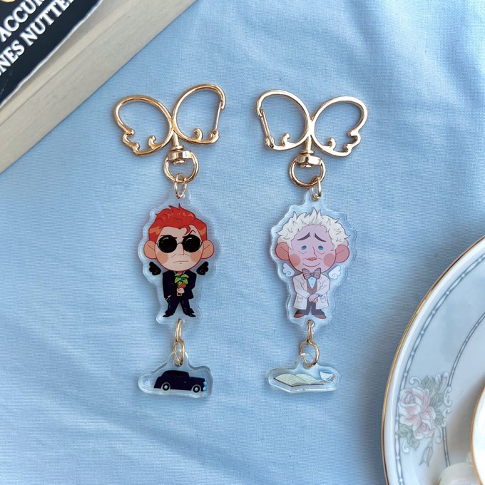 PRE-ORDERS UPDATE The good omens gummies and phoenix heart buttons arrived today and I'm SO happy with them!! Looking forward to mailing these out ASAP! Ace attorney gummies sticker sheet is still in production 