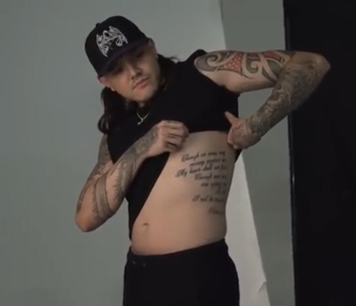 Dominik Mysterio's rib piece was the first tattoo he got when he was only  15 It took three and a half hours and he was biting into a neck pillow the  entire, image size:1200x1033